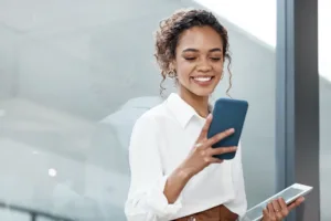 Business woman looking at blue phone