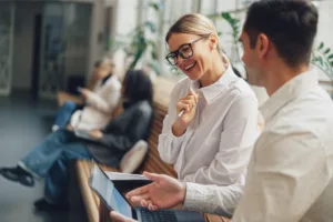 Woman smiling looking at laptop