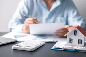 Man signing home closing documents