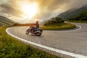 Motorcycle driving down windy road