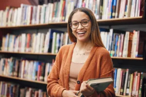 Student smiling in library