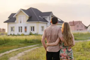 Couple hugging and looking at home